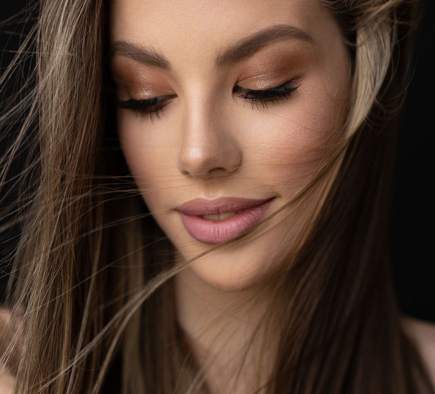 Close-up of a woman's serene beauty shot.