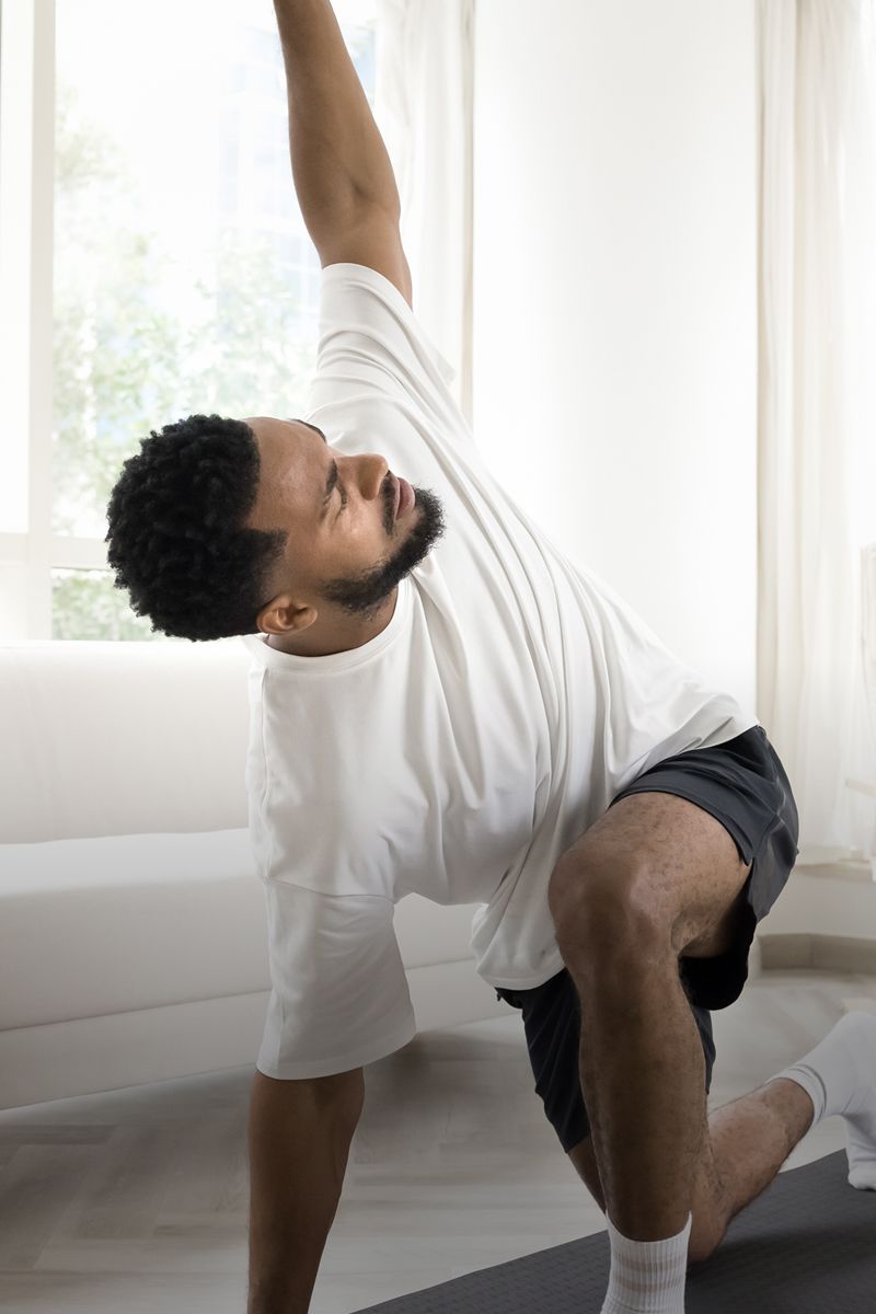 Woman enjoying sunlight outdoors with closed eyes.
