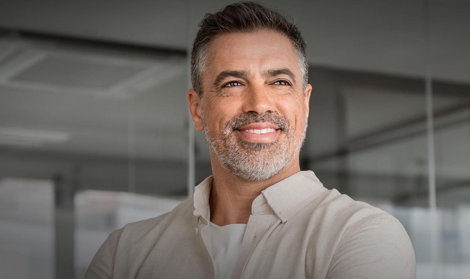 Smiling couple enjoying outdoor moment by water.